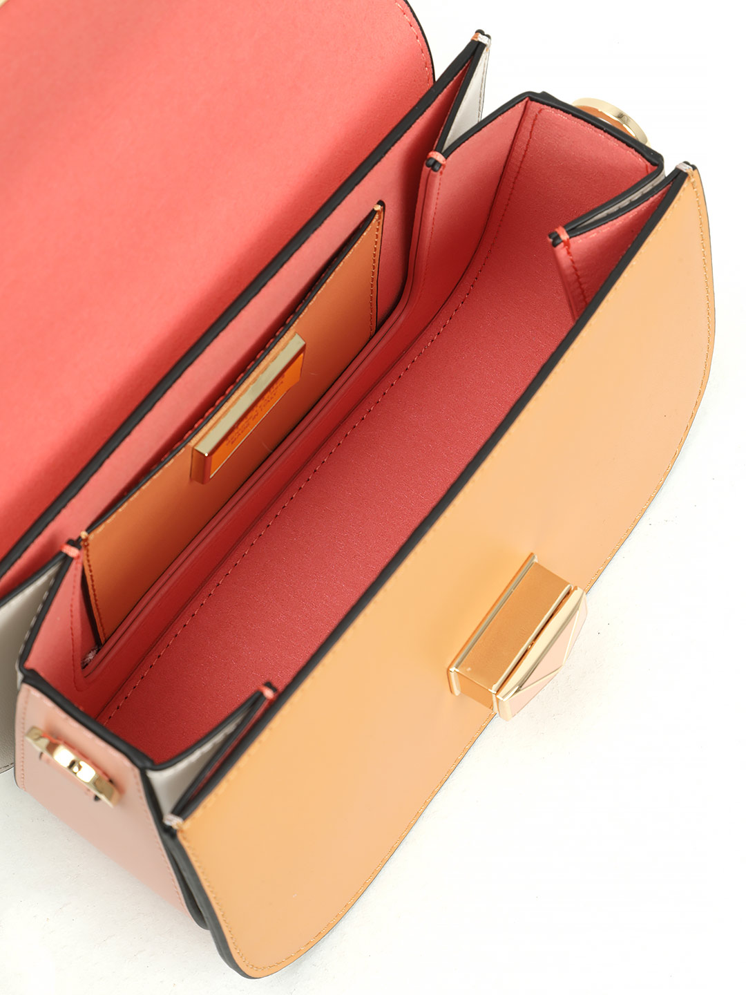 Маленькая сумка с поворотным замком на фирменной пряжке от Cromia из рыжей и розовой кожи