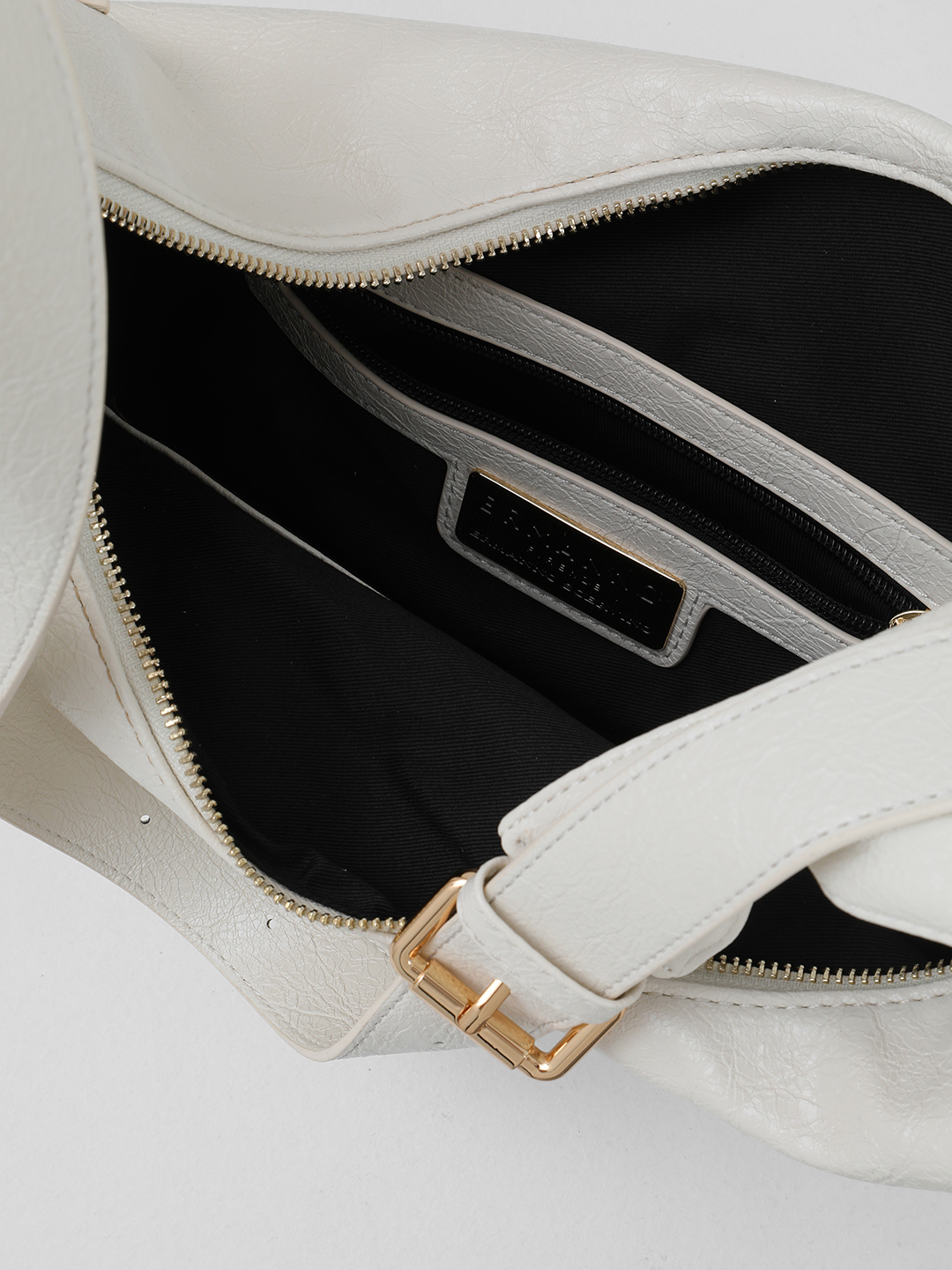 Сумка-мешок в размере L с тонкими боковыми ремнями от ERMANNO FIRENZE в оттенке слоновой кости